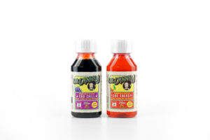 CBD infused Grape syrup next to cherry syrup